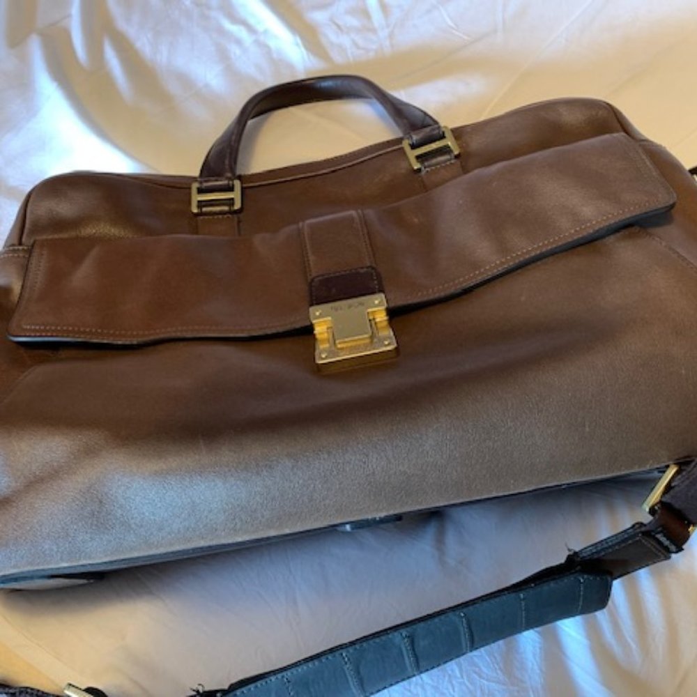 Quality Tumi bag, full grained rich looking brown leather, with strap